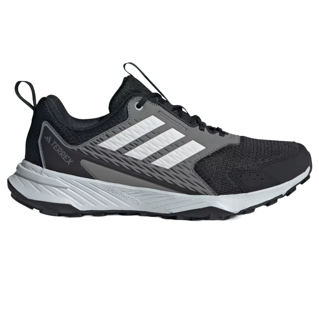 Adidas Women's Tracefinder Shoes are black trail running shoes featuring white stripes, a padded collar, lightweight mesh upper, and a robust rubber outsole for grip.