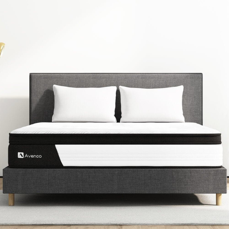 The Avenco Memory Foam Queen Mattress features a sleek design in white and black with a quilted top on a sturdy, upholstered platform bed.