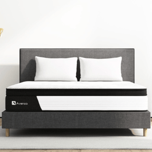 The Avenco Memory Foam Queen Mattress features a sleek design in white and black with a quilted top on a sturdy, upholstered platform bed.