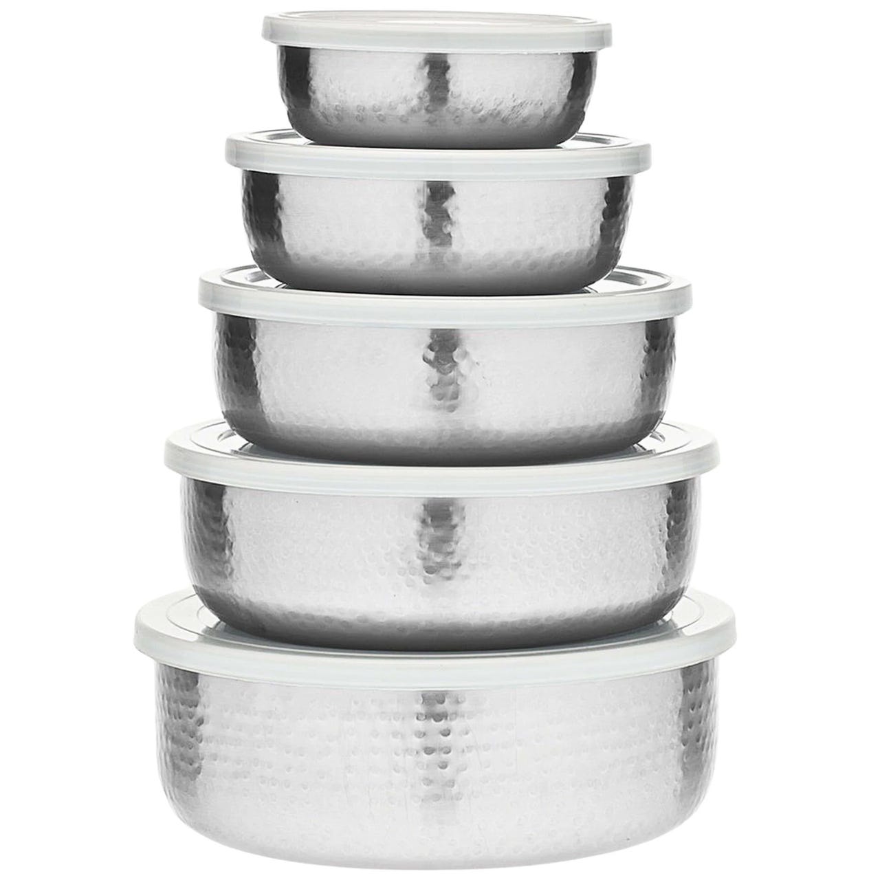 A set of five stainless steel storage bowls with hammered texture and white lids, stacked in decreasing size order.