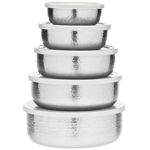 A set of five stainless steel storage bowls with hammered texture and white lids, stacked in decreasing size order.