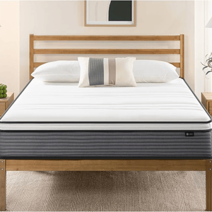 A neatly made bed with a white mattress and pillow on a wooden frame. The bed has a striped accent pillow, with a minimalist design suitable for a modern bedroom.