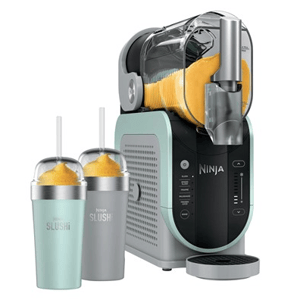 A Ninja slushie machine is shown alongside two cups of orange slush, each with a straw.