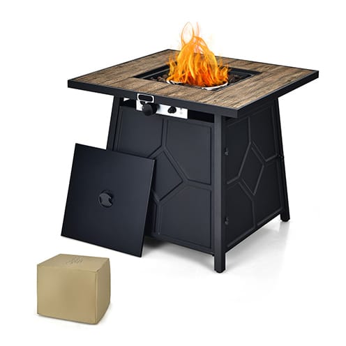 Square gas fire pit table with a wooden top finish and an access door at the base, accompanied by a beige cover.
