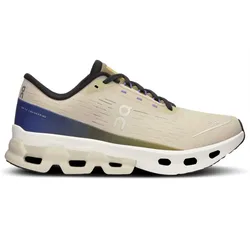 A beige and blue athletic shoe with distinctive cushioning and ventilation holes, featuring the \“on\“ logo and labeled \“Swiss Engineering\“ on the heel.