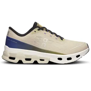 A beige and blue athletic shoe with distinctive cushioning and ventilation holes, featuring the \“on\“ logo and labeled \“Swiss Engineering\“ on the heel.