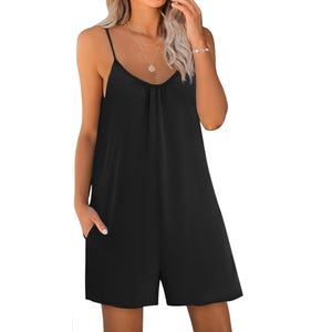 Black summer romper featuring a loose fit, thin spaghetti straps, and pockets. The design is simple and casual, with a U-shaped neckline and knee-length shorts.