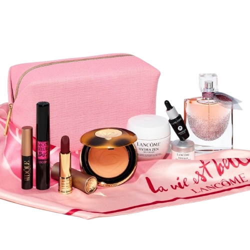 10-piece Lancôme set with pink bag includes mascara, eyeshadow stick, lipstick, bronzer compact, Hydra Zen cream, Advanced Génifique serum, La Vie Est Belle fragrance, a mini makeup remover, all on a pink cloth with \“La Vie Est Belle\“ text.