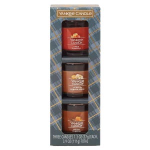 Yankee Candle set with three 1.3 oz votive candles in Apple Pumpkin, Pumpkin Banana Scone, and Spiced Pumpkin scents.