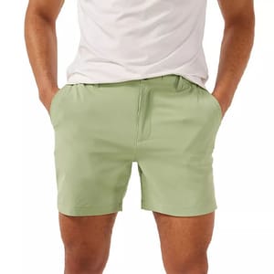 Light green Chubbies Performance Shorts with a flat front, belt loops, side pockets, and ending above the knee, paired with a white shirt.