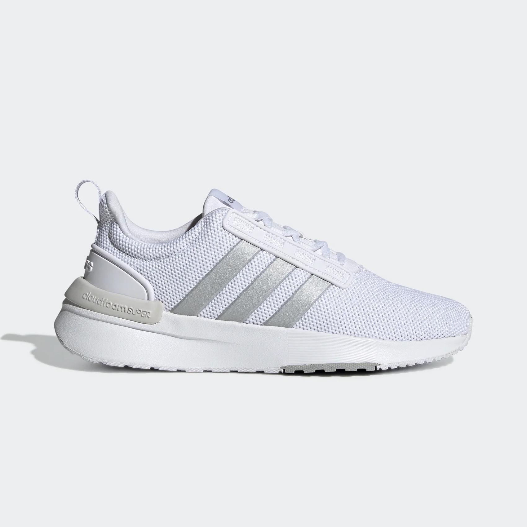 A white Adidas sneaker with grey stripes and \“cloudfoam\“ text on the heel.