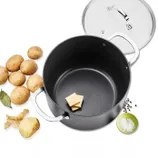 A nonstick pot with a lid is shown alongside potatoes, a bay leaf, peeled potato pieces, butter squares, salt in a green bowl, and peppercorns.