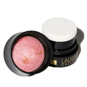 Laura Geller Baked to Go Blush-n-Brighten Blush features a pink marbled blush in a portable container with a built-in sponge applicator.