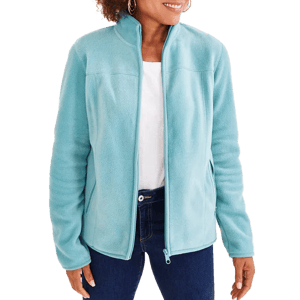 A person wearing a light blue fleece jacket with a zip-up front, paired with a white shirt and blue jeans.