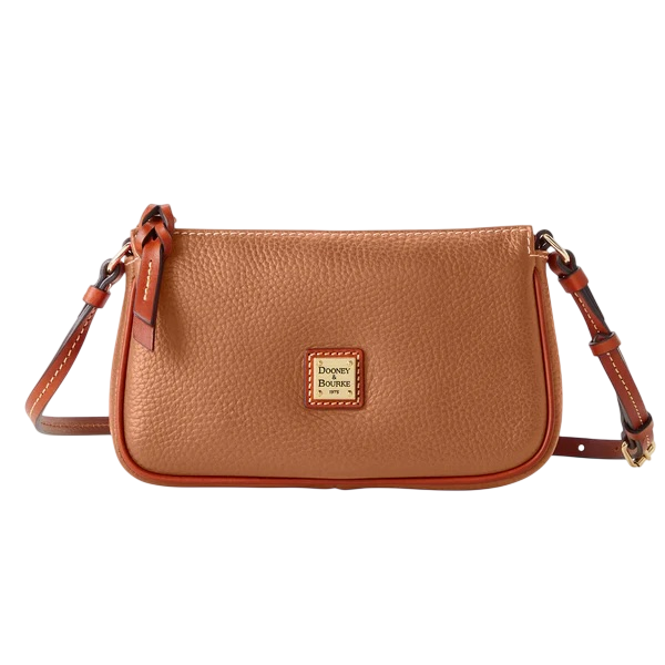 A tan leather crossbody bag from Dooney & Bourke with a pebbled texture, featuring an adjustable strap and a logo plaque on the front.