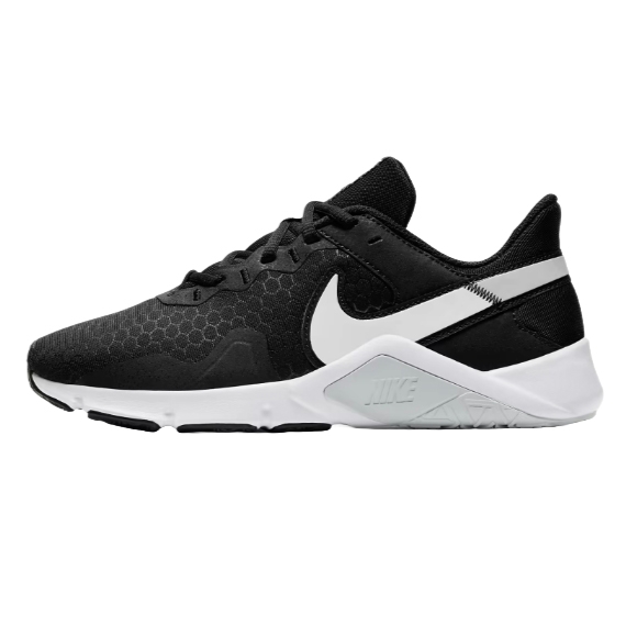 A black and white athletic shoe featuring a hexagonal pattern on the upper and a prominent white logo on the side, designed with a supportive sole for training or casual wear.