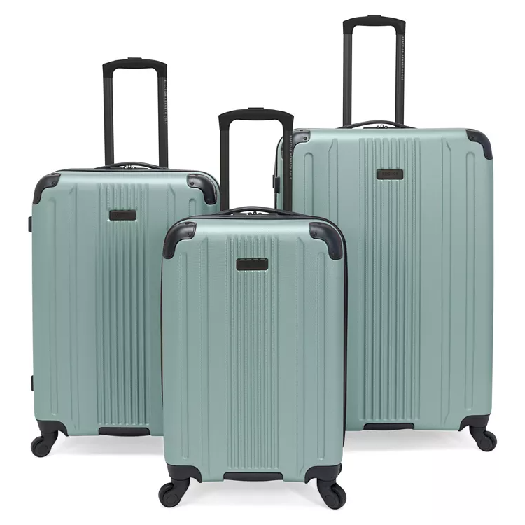 Three mint green hardshell suitcases with telescopic handles and spinner wheels are shown. The set includes three different sizes, suitable for various travel needs.
