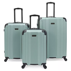 Three mint green hardshell suitcases with telescopic handles and spinner wheels are shown. The set includes three different sizes, suitable for various travel needs.