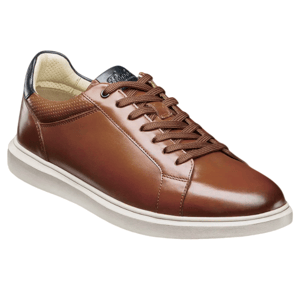 A brown leather sneaker with a white sole, featuring brown laces and a black heel tab.
