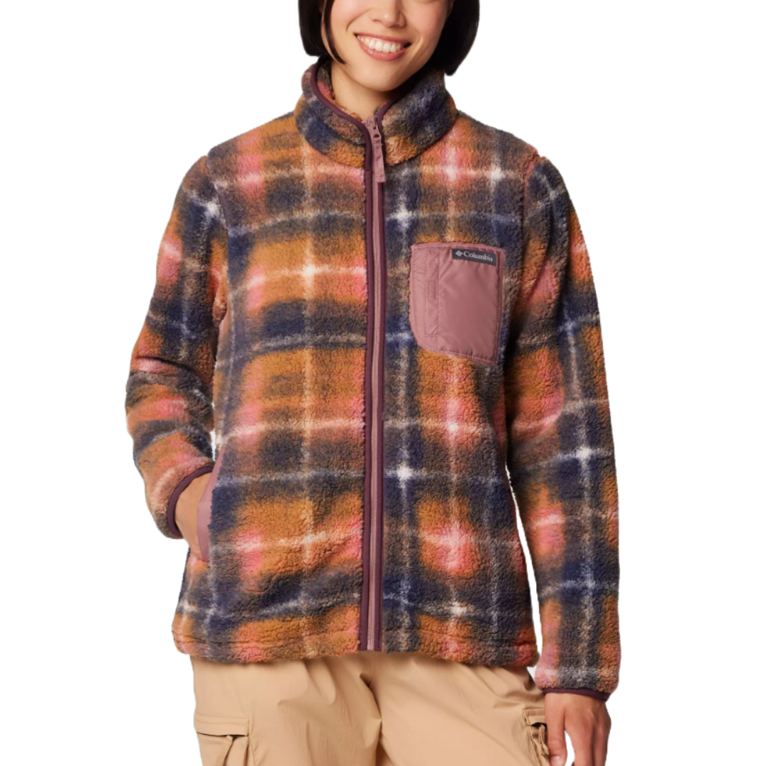 A plaid fleece jacket with a full zipper, featuring shades of brown, pink, and blue, and a contrasting chest pocket. The jacket is paired with beige cargo pants.