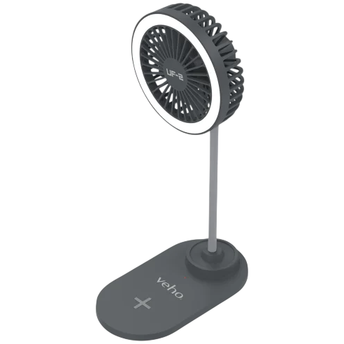 A small desktop fan with LED lighting on a vertical stand, featuring a wireless charging pad on the base labeled \“Veho.\“
