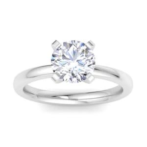 A solitaire ring featuring a 2-carat round lab-grown diamond set in a classic 14K white gold band with four prongs.