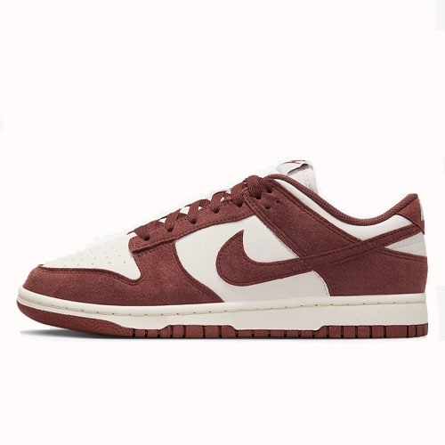 Nike Dunk Low sneaker in brown and white with a suede upper and signature Swoosh logo.