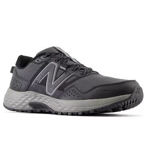 Gray athletic shoe with mesh upper, lace-up design, and cushioned sole. Prominent logo on the side.