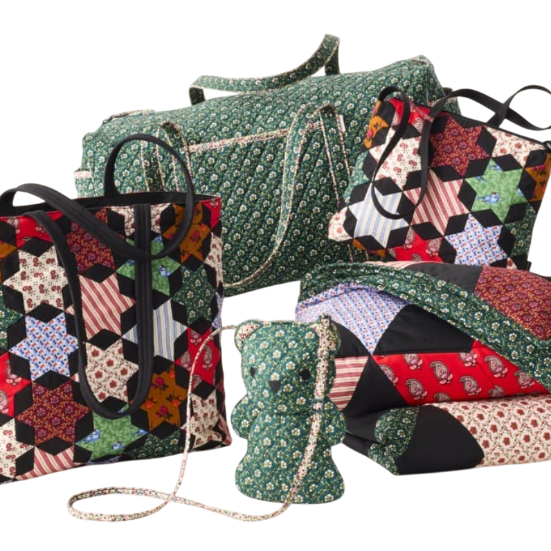A collection of quilted bags and accessories featuring patchwork designs and floral patterns, including a duffel bag, tote bags, a bear-shaped bag, and a quilt.
