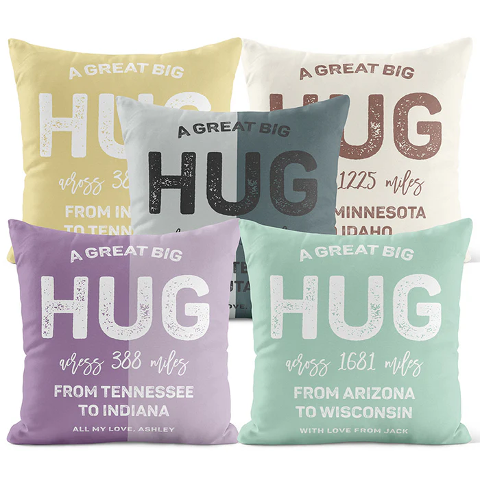 Five decorative pillows feature messages of sending a hug across various distances, with personalized notes and different state pairings.