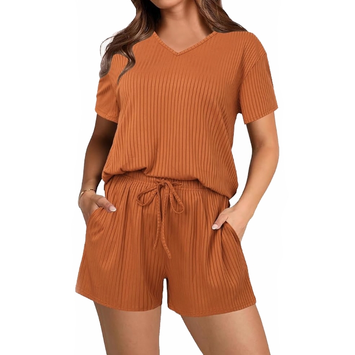 A ribbed knit loungewear set in rust color featuring a V-neck short-sleeve top and matching drawstring shorts with pockets.