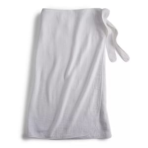White cotton gauze bath wrap with a textured surface and tie closure, designed for post-bath use.