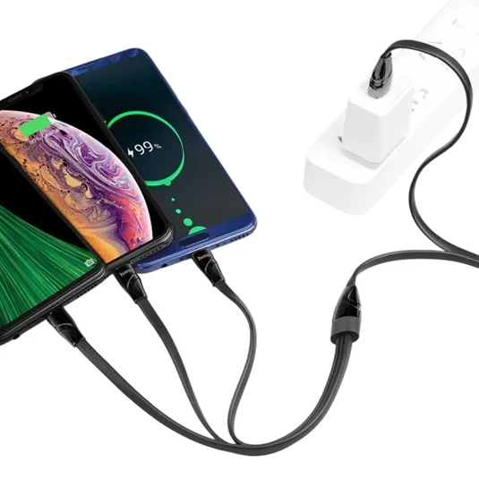 Two smartphones are being charged simultaneously using a multi-port USB cable connected to a power strip. Each device is displayed with a charging screen, showing a battery percentage.