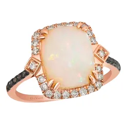 A rose gold ring featuring a large rectangular opal center stone, surrounded by a halo of small diamonds and additional diamond accents on the band.