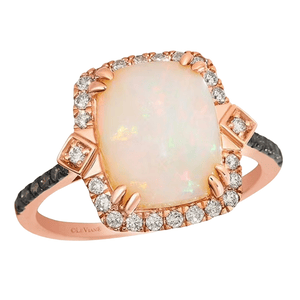 A rose gold ring featuring a large rectangular opal center stone, surrounded by a halo of small diamonds and additional diamond accents on the band.