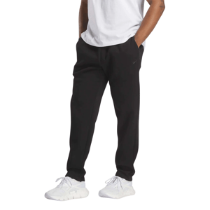 A person is wearing black joggers with a subtle logo near the pocket, paired with a white T-shirt and white sneakers.
