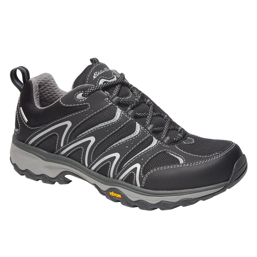 Eddie Bauer Men's Waterproof Hikers feature a durable black design with gray accents, a Vibram sole for enhanced grip, and a breathable, waterproof material to keep feet dry.