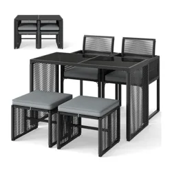 A compact bistro set with a black metal frame featuring a square table and four cushioned chairs that can be neatly tucked under the table for efficient space-saving storage.
