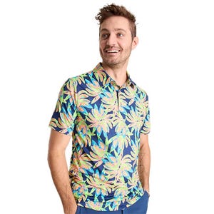 Chubbies Golf Polos feature a vibrant floral design with a navy background, short sleeves, and a classic collar. Perfect for adding a splash of color to a golf attire.
