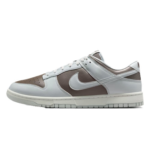 Nike Dunk Low sneaker with a brown and light gray color scheme, featuring a low-top design and the iconic swoosh logo on the side.