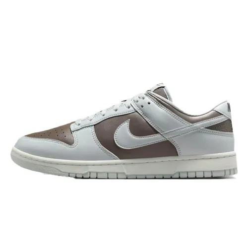 Nike Dunk Low sneaker with a brown and light gray color scheme, featuring a low-top design and the iconic swoosh logo on the side.
