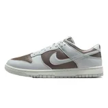 Nike Dunk Low sneaker with a brown and light gray color scheme, featuring a low-top design and the iconic swoosh logo on the side.