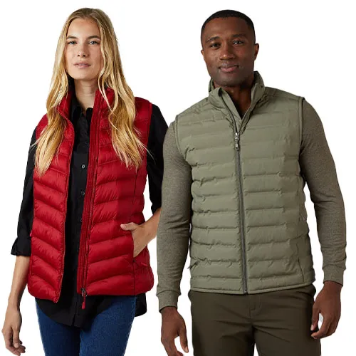 A woman wears a red quilted puffer vest over a black shirt, and a man wears an olive green quilted vest over a green long-sleeve shirt.
