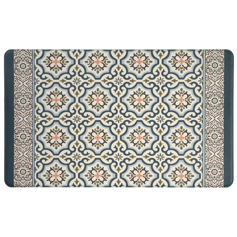 18\“ x 30\“ Anti-Fatigue Medallion Mat features a tile-like pattern with intricate geometric and floral designs in blue, beige, and peach hues, framed by a detailed border.