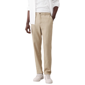 Men’s beige linen-blend pants with a straight fit, featuring a button closure and paired with white casual shoes.