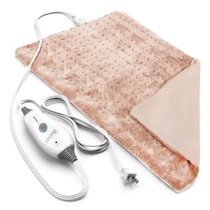 The Pure Enrichment Deluxe Heating Pad is a soft, textured, beige electric pad for heat therapy, featuring a digital controller attached via a cord, suitable for providing warmth and relief.