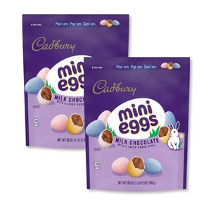Two 28oz bags of Cadbury Mini Eggs, featuring milk chocolate with a crisp sugar shell. The packaging is purple with images of pastel-colored eggs and a small white rabbit illustration.