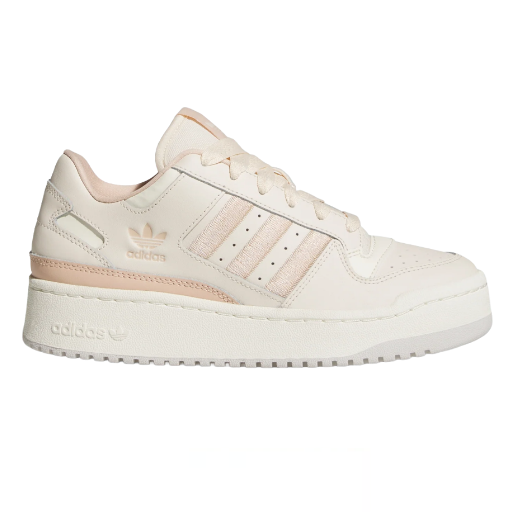 Adidas sneaker in a cream color with three stripes on the side, featuring a flat sole and minimal design elements.