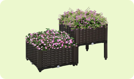 Two brown wicker-style planter boxes with legs, featuring pink and purple flowering plants.