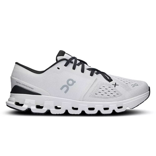 A white athletic shoe with black laces from On, featuring a distinctive perforated sole and minimal design.